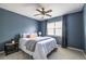 Cozy bedroom with a window, neutral carpet, and a ceiling fan at 1100 Ashbury Dr, Decatur, GA 30030