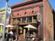 Exterior view of the Brick Store Pub with outdoor seating and unique decor at 1100 Ashbury Dr, Decatur, GA 30030