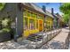 Exterior shot of The Deer and The Dove restaurant featuring yellow windows, grey brick and stairs at 1100 Ashbury Dr, Decatur, GA 30030