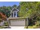 Charming two-story home with a well-maintained lawn and a two car garage at 1100 Ashbury Dr, Decatur, GA 30030