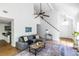Open-concept living room with vaulted ceilings and hardwood floors at 1100 Ashbury Dr, Decatur, GA 30030