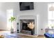 Bright living room featuring a marble fireplace with a mounted television above it at 1100 Ashbury Dr, Decatur, GA 30030