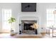 Bright living room featuring a marble fireplace with a mounted television above it at 1100 Ashbury Dr, Decatur, GA 30030