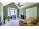 Spacious office with a sofa, closet, mini fridge, and a large bay window at 1100 Ashbury Dr, Decatur, GA 30030
