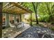 Inviting outdoor space with pergola, dining set, and a mix of concrete and gravel patio at 1100 Ashbury Dr, Decatur, GA 30030