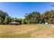 Expansive park featuring a covered picnic area, basketball court, and mature trees at 1100 Ashbury Dr, Decatur, GA 30030