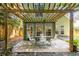 Relaxing covered patio area with outdoor seating and beautiful wooded views at 1100 Ashbury Dr, Decatur, GA 30030