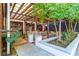 Charming outdoor patio area with covered seating and lush greenery at 1100 Ashbury Dr, Decatur, GA 30030