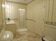 Cozy bathroom featuring wallpaper, a walk-in shower, vanity and a basket of towels at 1811 Murdock Rd, Marietta, GA 30062