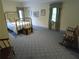 Bedroom featuring carpet, rocking chair, and plenty of sunlight at 1811 Murdock Rd, Marietta, GA 30062