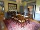 Bright dining room boasts hardwood floors, chandelier, and adjacent access to the kitchen for convenient entertaining at 1811 Murdock Rd, Marietta, GA 30062