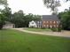 Traditional two-story home with a brick facade and a three-car detached garage at 1811 Murdock Rd, Marietta, GA 30062