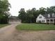 Charming home with a circular gravel driveway and three-car detached garage at 1811 Murdock Rd, Marietta, GA 30062