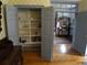 Hallway with shelves features hardwood floors and an open layout leading to a dressing room at 1811 Murdock Rd, Marietta, GA 30062