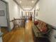Well-lit hallway showcasing hardwood floors, elegant trim, and decorative wall art, adding character to the home at 1811 Murdock Rd, Marietta, GA 30062