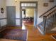 Traditional hallway features hardwood floors and staircase leading to a formal dining room with elegant chandelier at 1811 Murdock Rd, Marietta, GA 30062