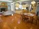 Open concept eat-in kitchen and living space with hardwood floors and a stone fireplace at 1811 Murdock Rd, Marietta, GA 30062