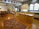 Open eat-in kitchen including hardwood floors, island, custom cabinets, and fireplace at 1811 Murdock Rd, Marietta, GA 30062