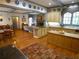 This open eat-in kitchen includes hardwood floors, an island, and access to a stone fireplace at 1811 Murdock Rd, Marietta, GA 30062