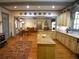 Open eat-in kitchen includes a center island, hardwood floors, custom cabinets and traditional decorations at 1811 Murdock Rd, Marietta, GA 30062