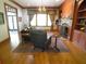 Cozy living room with hardwood floors, a fireplace, large windows, and custom draperies at 1811 Murdock Rd, Marietta, GA 30062