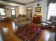 Open living room boasts hardwood floors, traditional furnishings, and abundant natural light, creating an elegant and inviting space at 1811 Murdock Rd, Marietta, GA 30062