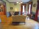 Living room with hardwood floors, striped furniture, and red window treatments at 1811 Murdock Rd, Marietta, GA 30062