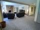 Comfortable living room with carpet, a brick fireplace, and comfortable seating for relaxation at 1811 Murdock Rd, Marietta, GA 30062