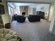 Open living area with a fireplace, plush seating, and ample natural light at 1811 Murdock Rd, Marietta, GA 30062
