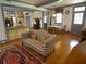 Bright living room features hardwood floors, traditional furniture, and an open floor plan connecting to the kitchen and dining area at 1811 Murdock Rd, Marietta, GA 30062