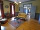 Bright living room featuring hardwood floors, area rug, and a stylish chandelier, perfect for relaxation and entertainment at 1811 Murdock Rd, Marietta, GA 30062