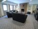 Comfortable living room featuring a brick fireplace, plush seating, and a door to the outside at 1811 Murdock Rd, Marietta, GA 30062