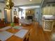 Inviting living room features hardwood floors, stone fireplace, and open layout to the kitchen and dining areas at 1811 Murdock Rd, Marietta, GA 30062