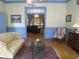 Comfortable sitting room boasts hardwood floors, a patterned sofa, and tranquil blue accents at 1811 Murdock Rd, Marietta, GA 30062