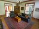 Living room with hardwood floors, fireplace, comfortable seating, and vintage hutch at 1811 Murdock Rd, Marietta, GA 30062
