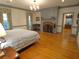 Spacious main bedroom featuring hardwood floors, a fireplace, and ample natural light at 1811 Murdock Rd, Marietta, GA 30062