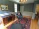 Elegant study with hardwood floors, classic furnishings, and decorative wall paneling at 1811 Murdock Rd, Marietta, GA 30062