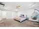 Large bedroom with ceiling fan, hanging swing chair and adjacent bathroom at 2121 Harmony Dr, Canton, GA 30115