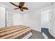 A bedroom with a ceiling fan and two doorways at 2121 Harmony Dr, Canton, GA 30115