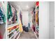 Large closet features ample storage space with custom shelving and hanging rods at 2121 Harmony Dr, Canton, GA 30115