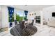 Elegant dining space with view, features round table and stylish upholstered chairs at 2121 Harmony Dr, Canton, GA 30115