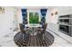 Chic dining area with round table, velvet chairs, and modern black and white rug at 2121 Harmony Dr, Canton, GA 30115