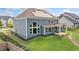 A blue two-story home featuring modern solar panels and a cozy covered porch off the back at 2121 Harmony Dr, Canton, GA 30115