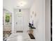 Bright foyer with white walls, marble floors, and elegant decor including a decorative console table at 2121 Harmony Dr, Canton, GA 30115