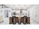 Bright kitchen featuring a center island with seating, white cabinets and marble floors at 2121 Harmony Dr, Canton, GA 30115
