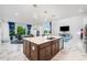 Kitchen with island connects seamlessly to dining area and living room creating an open layout at 2121 Harmony Dr, Canton, GA 30115