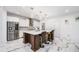 Modern kitchen with white cabinetry, marble floors, and large island with seating at 2121 Harmony Dr, Canton, GA 30115