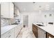 Well-lit kitchen with white cabinetry, stainless steel appliances, and marble countertops at 2121 Harmony Dr, Canton, GA 30115