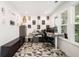 A home office featuring a modern desk, stylish decor, geometric-patterned flooring, and natural light at 2121 Harmony Dr, Canton, GA 30115
