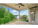 Covered patio with porch swing and view of backyard and mature trees at 2121 Harmony Dr, Canton, GA 30115